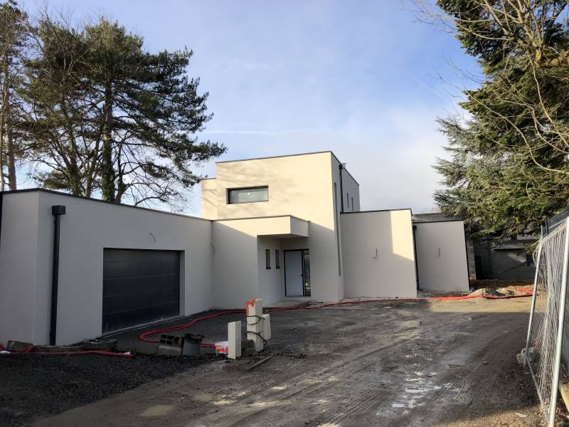 Construction d'une maison béton armé haut de gamme avec toiture terrasse Ouest Lyonnais