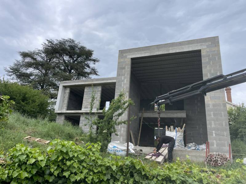 Entreprise de maçonnerie pour création d'une villa contemporaine avec baie vitrée à Saint Didier au mont d'Or